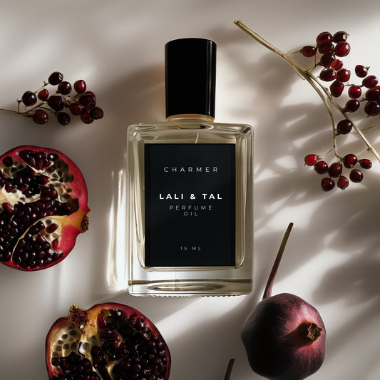LALI & TAL CHARMER perfume oil styled with ingredients that reflect the fragrance notes.